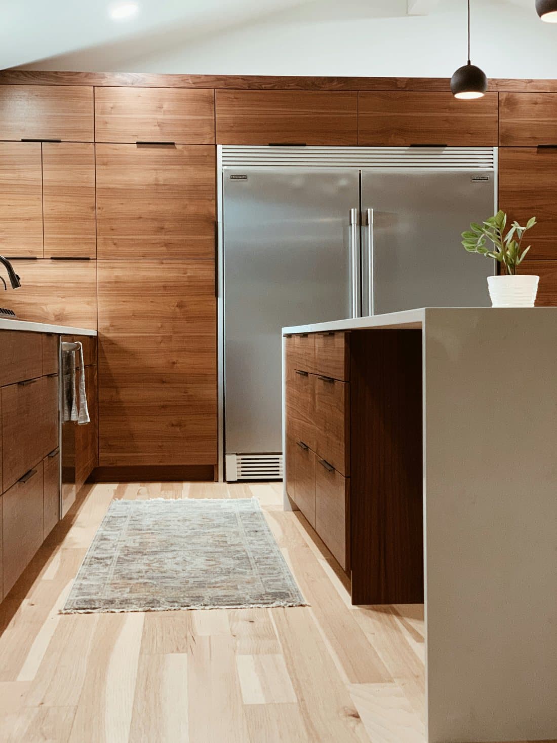 Walnut kitchen cabinetry and island millwork